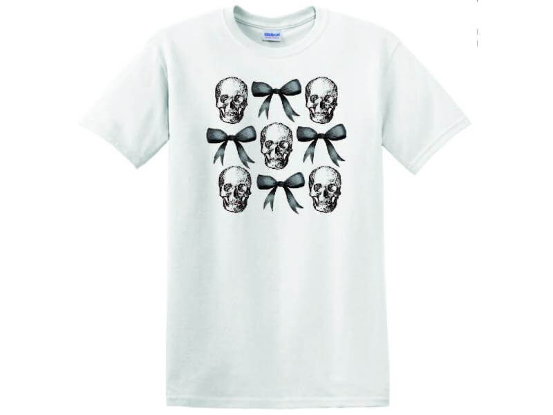 a white t - shirt with skulls and bow ties on it