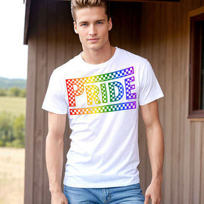 a man standing in front of a building wearing a pride t - shirt