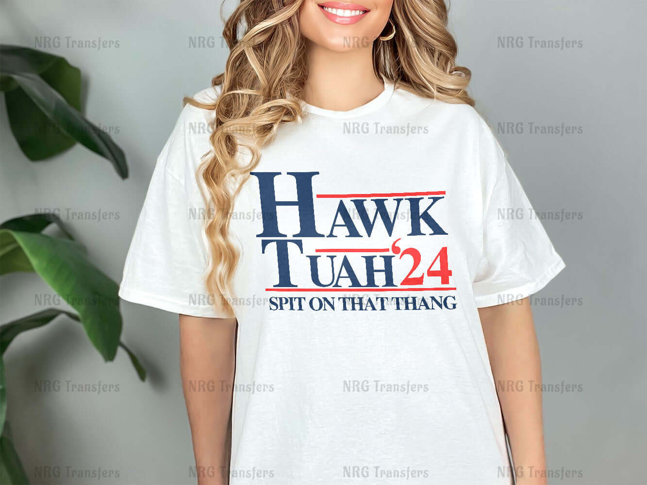 a woman wearing a hawk utah t - shirt