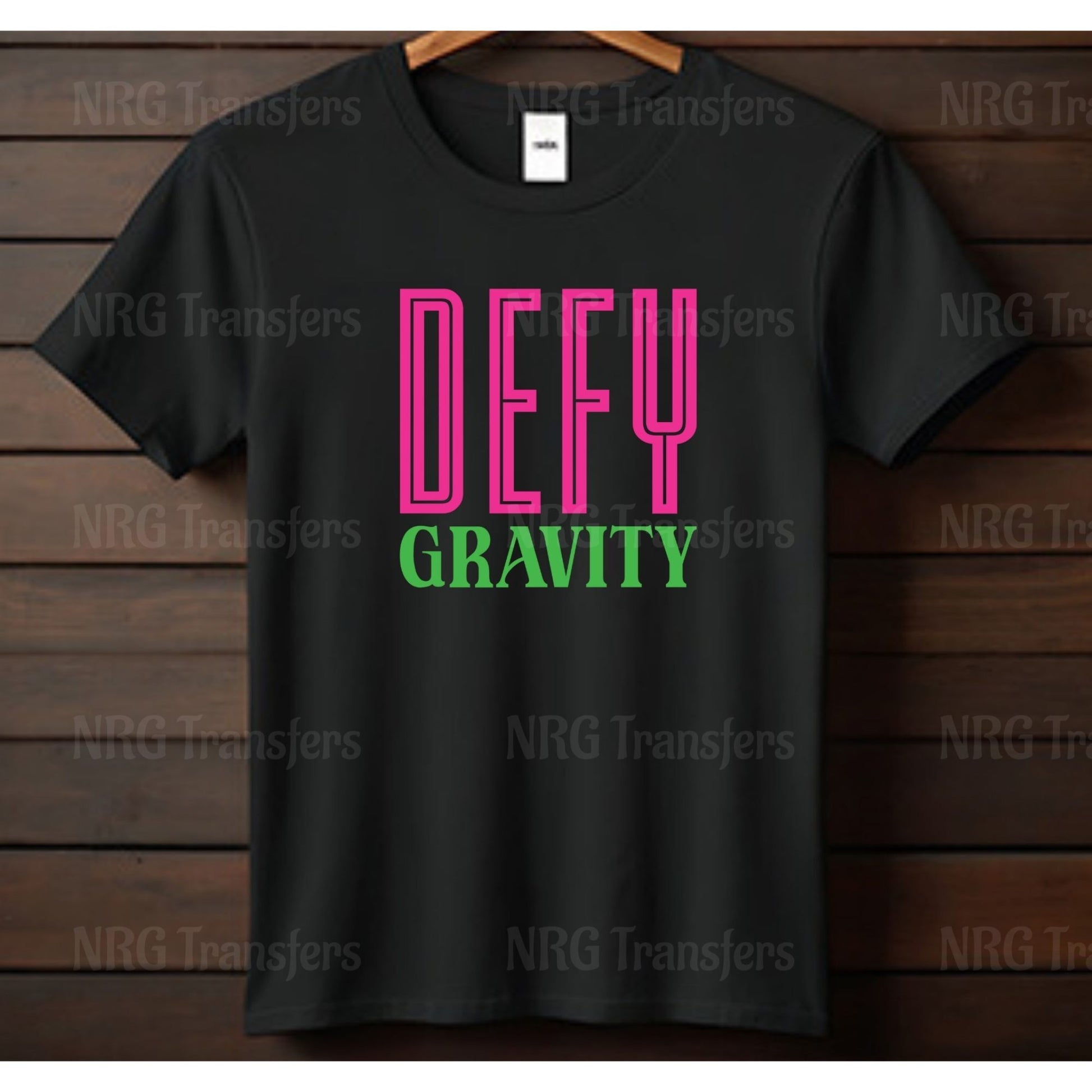 a black t - shirt with the words defy gravity printed on it