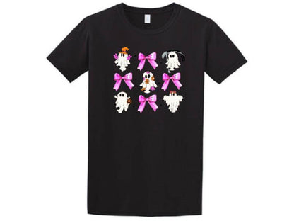 a black t - shirt with pink bows and ghostes on it