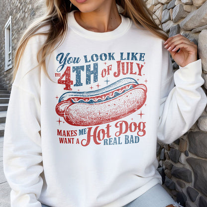 a woman wearing a sweatshirt with a hot dog on it