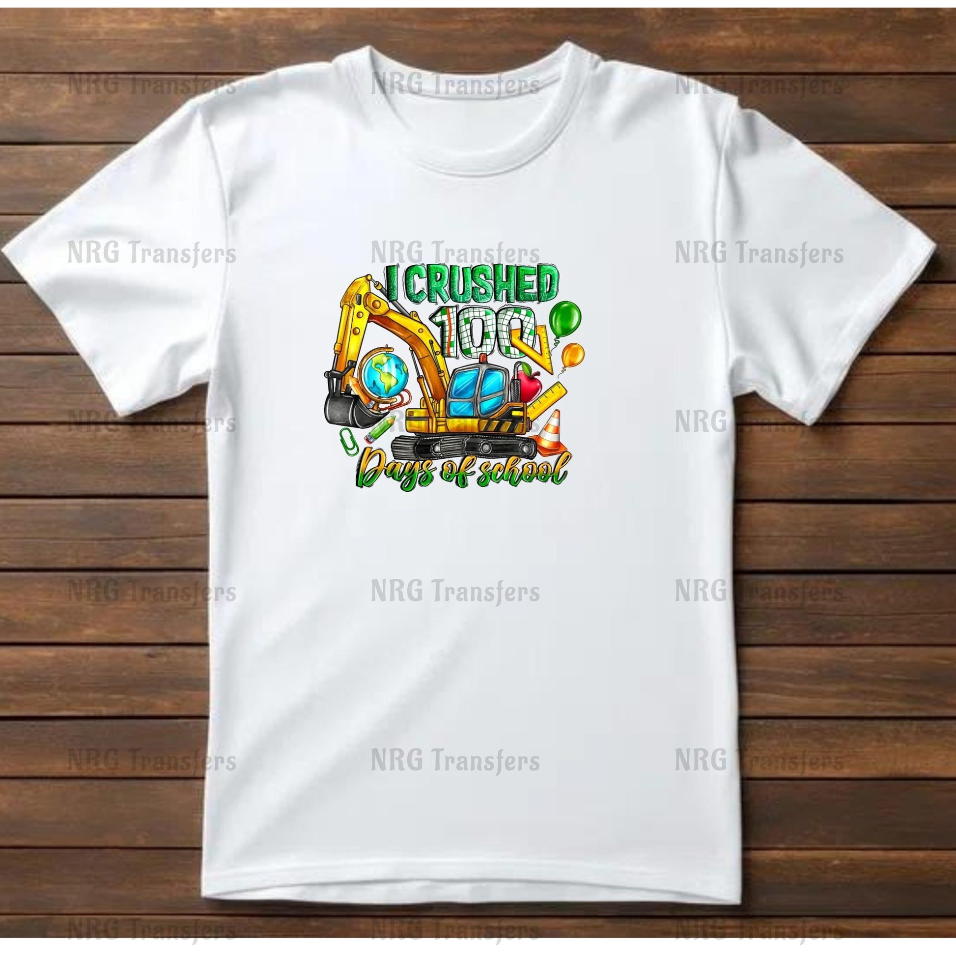 A white t-shirt with a graphic design depicting a yellow excavator and the text "I CRushed 100 Days of School".