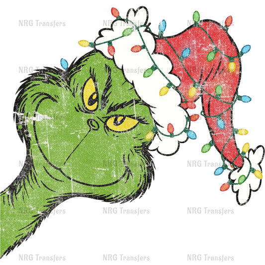 A grumpy-looking green character wearing a red Santa hat with colorful lights.