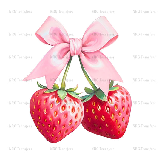 A pair of red strawberries with a pink bow tied around them.