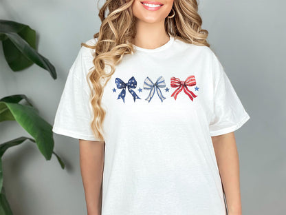 a woman wearing a t - shirt with bows on it