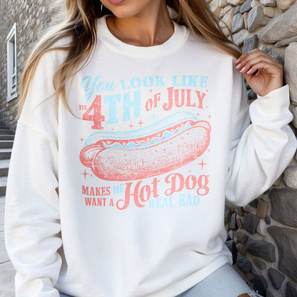 a woman wearing a sweatshirt with a hot dog on it