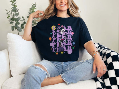 a woman sitting on a couch wearing a t - shirt that says fear fear fear