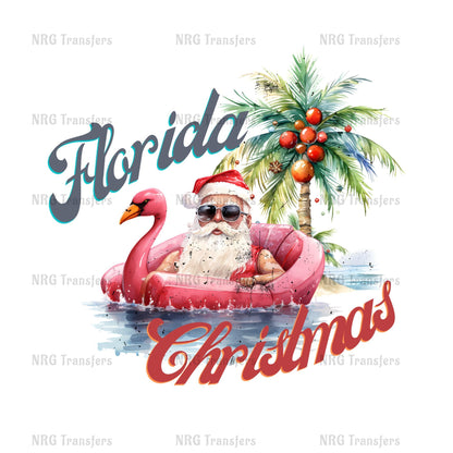 Santa Claus in a pink inflatable raft, wearing a Santa hat and sunglasses, floating on a body of water with a palm tree and Christmas decorations in the background.