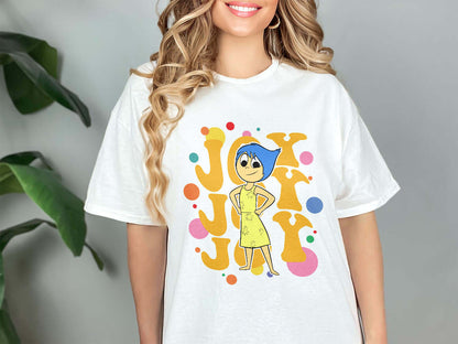 a woman wearing a white shirt with a cartoon character on it