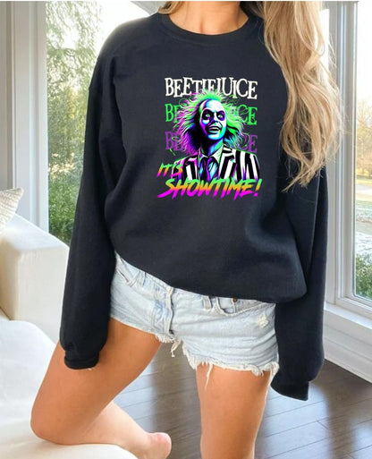 a woman wearing a black sweatshirt with a joker face on it