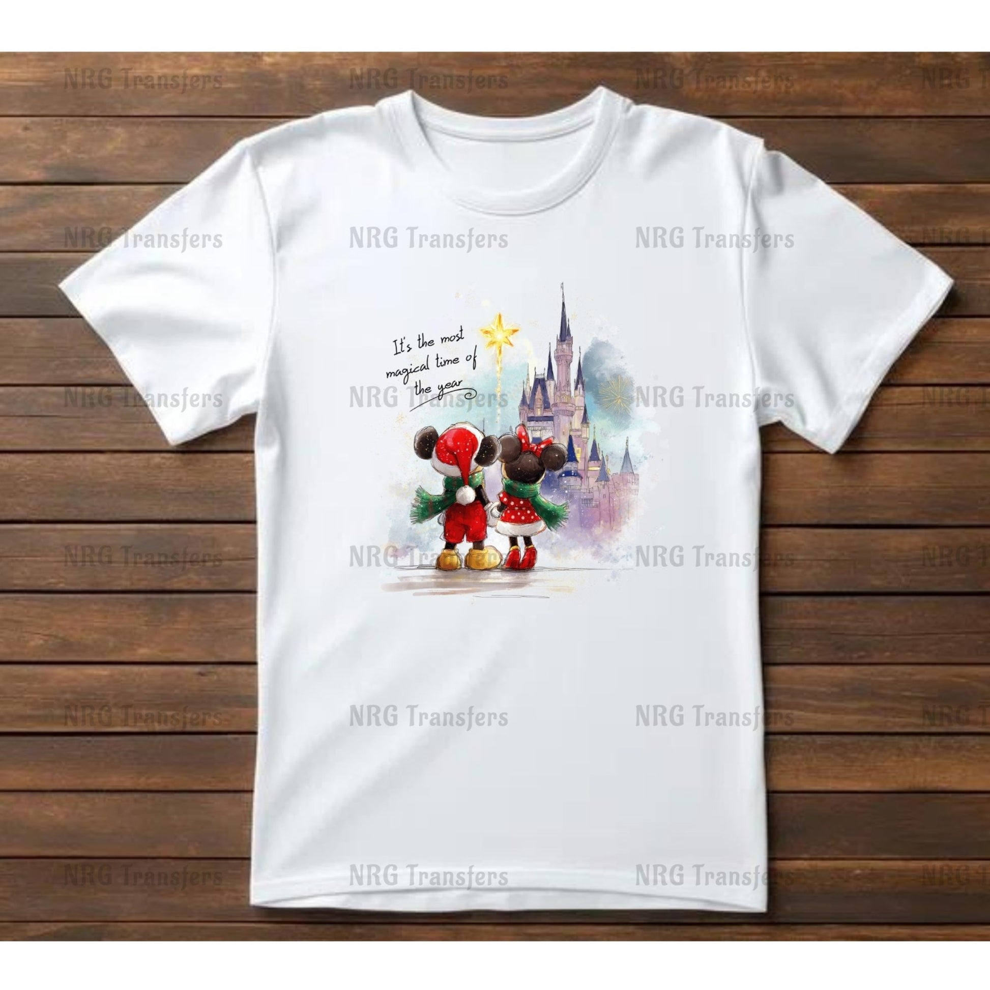 A white t-shirt with a printed design depicting Mickey Mouse and Minnie Mouse standing in front of a castle.