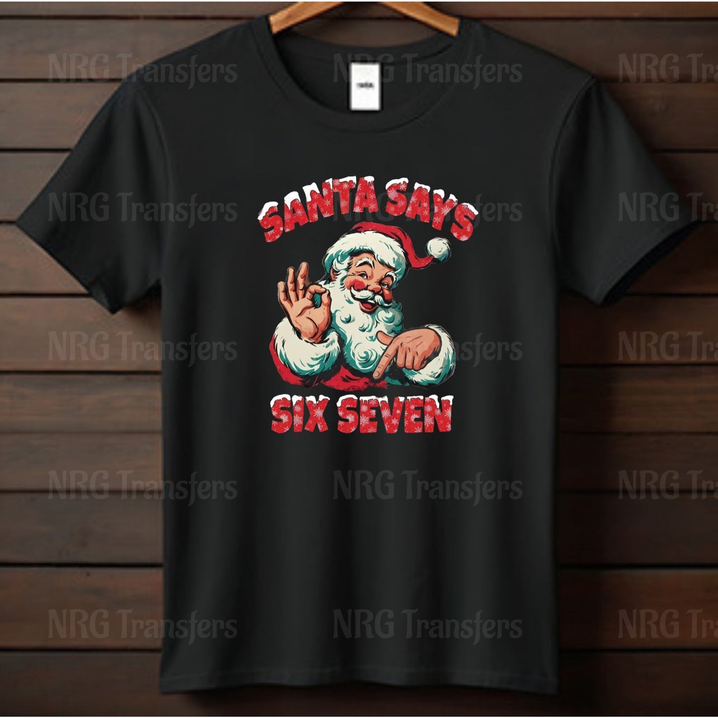 A black t-shirt with a graphic design featuring a smiling Santa Claus character and the text "Santa says six seven".