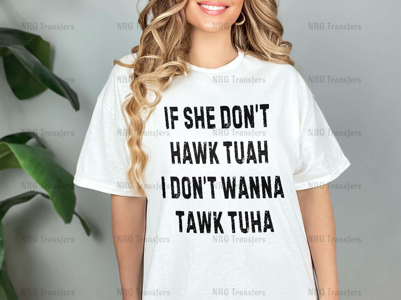 a woman wearing a white t - shirt that says if she don't hawk