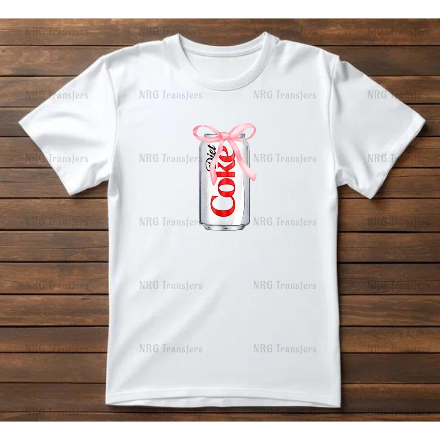 a white t - shirt with a pink ribbon and a can of coke