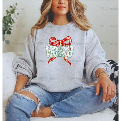A woman wearing a gray sweatshirt with a bow and the word "Merry" printed on it, sitting on a couch.