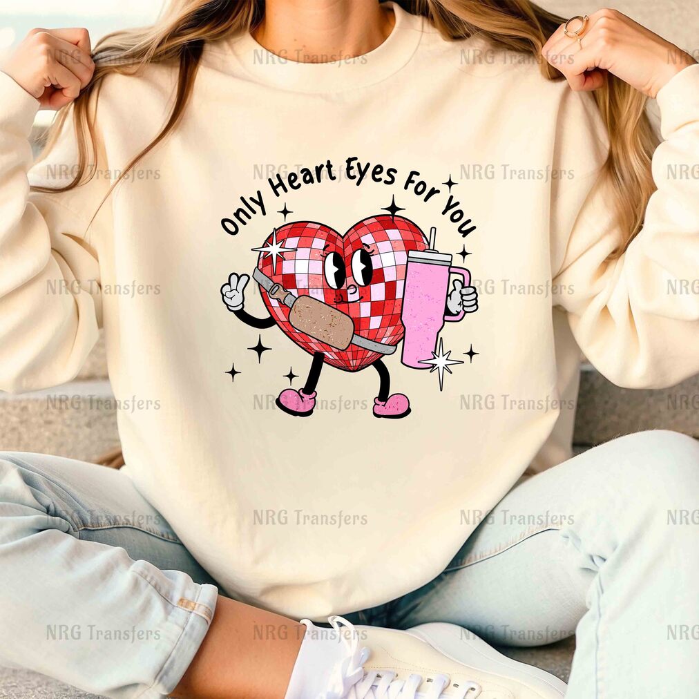 a woman wearing a sweatshirt with a heart on it