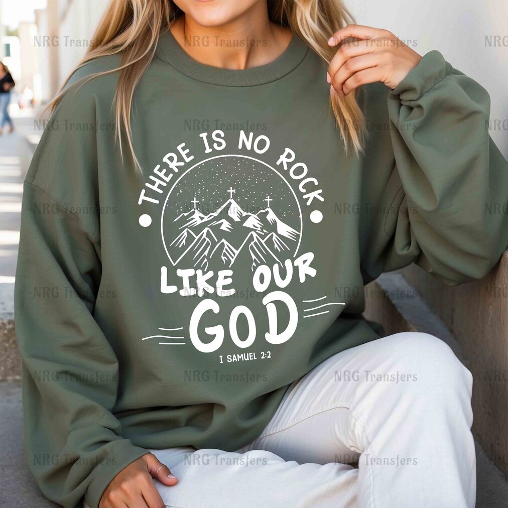 a woman wearing a sweatshirt that says, there is no rock like our god