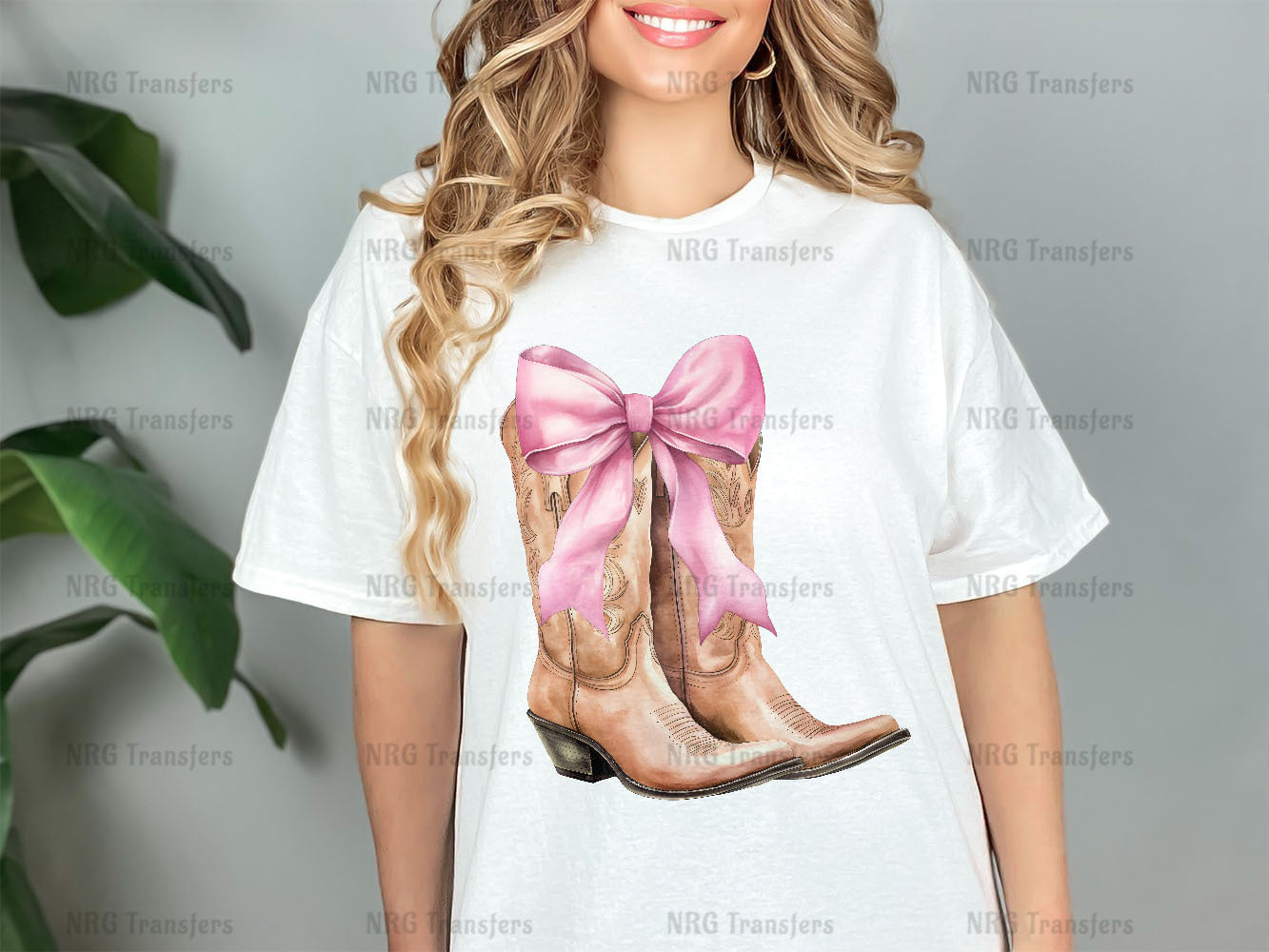 a woman wearing a t - shirt with a picture of a pair of cowboy boots