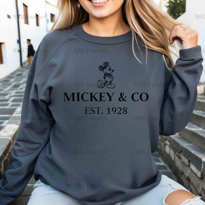 a woman wearing a mickey and co sweatshirt