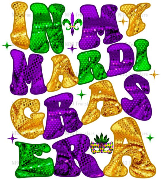 a mardi gras sign with gold and green letters