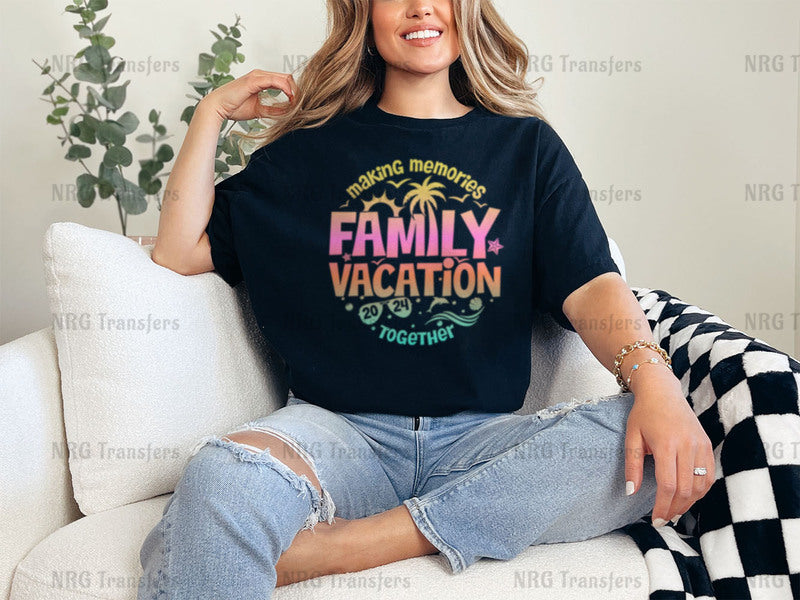 a woman sitting on a couch wearing a family vacation t - shirt