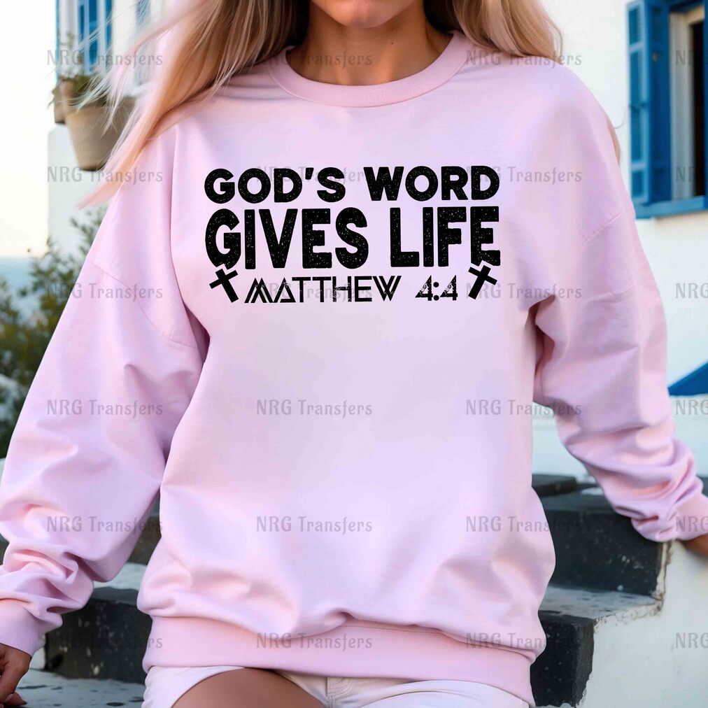 a woman wearing a pink sweatshirt that says god's word gives life