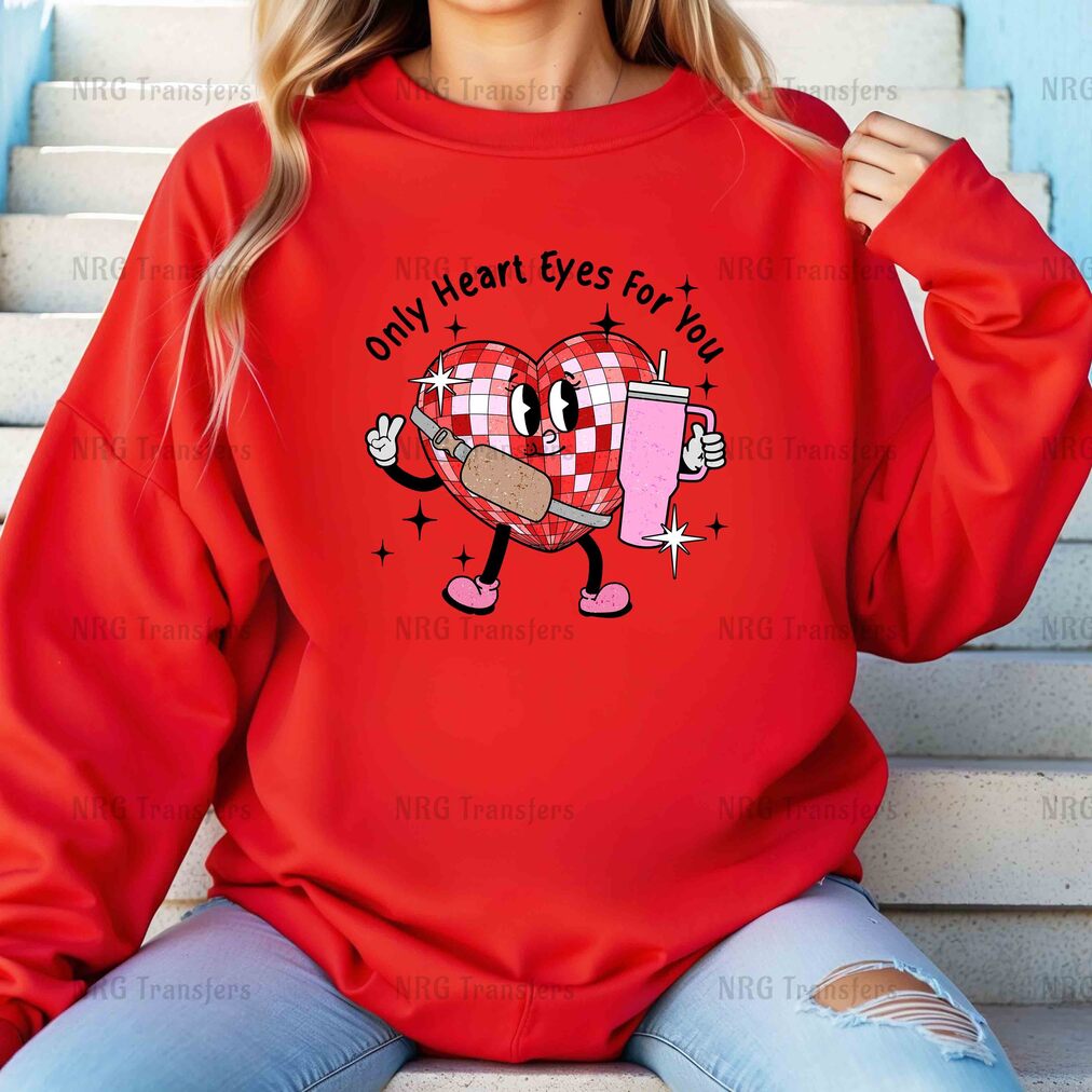 a woman wearing a red sweatshirt that says only heart eyes for you