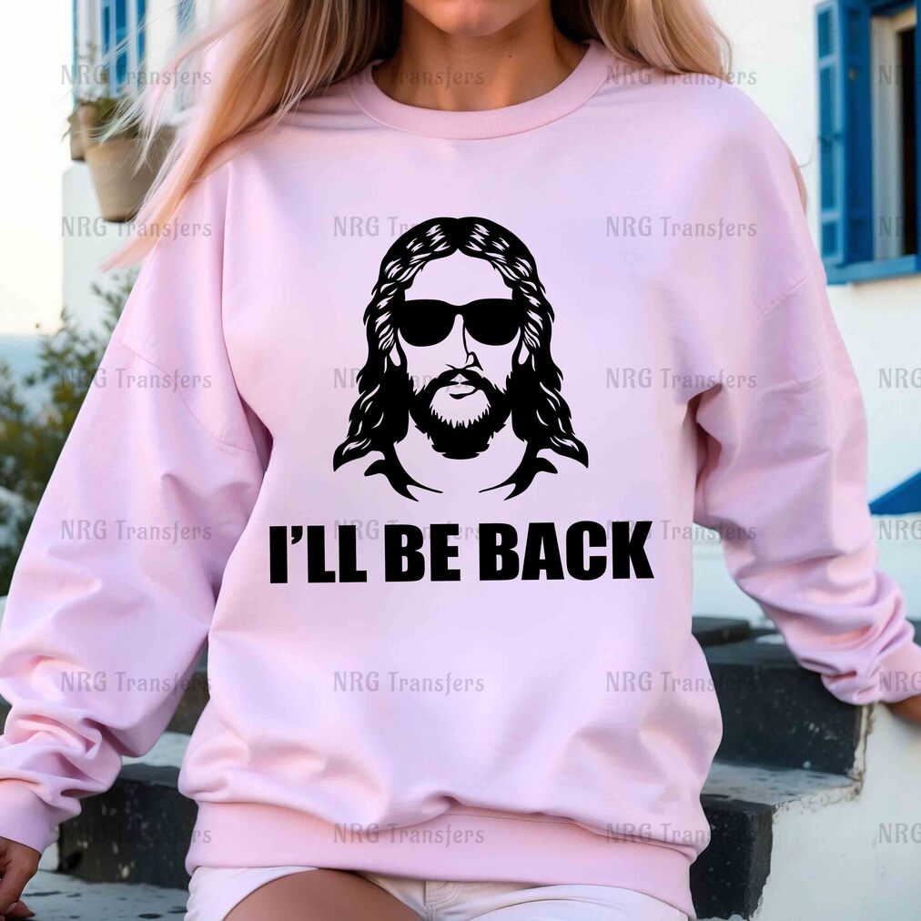 a woman wearing a pink sweatshirt that says i'll be back