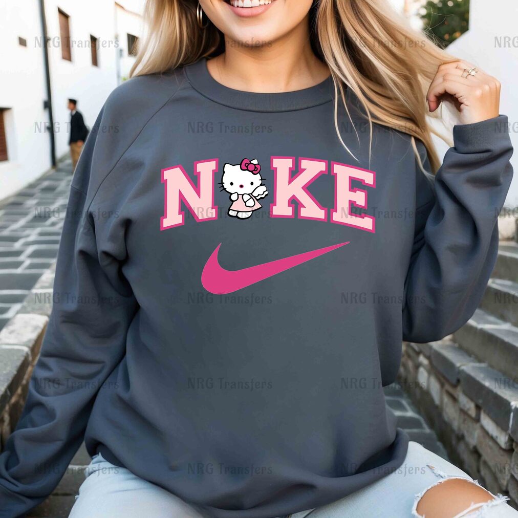 a woman wearing a sweatshirt with a hello kitty on it