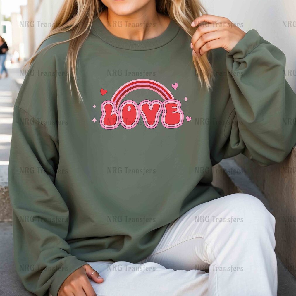 a woman wearing a sweatshirt with the word love on it