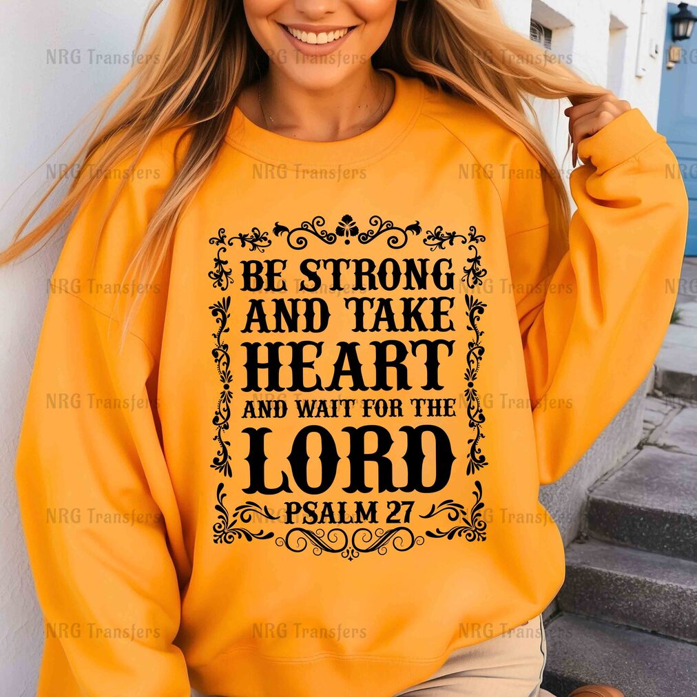 a woman wearing a sweatshirt that says be strong and take heart and wait for the