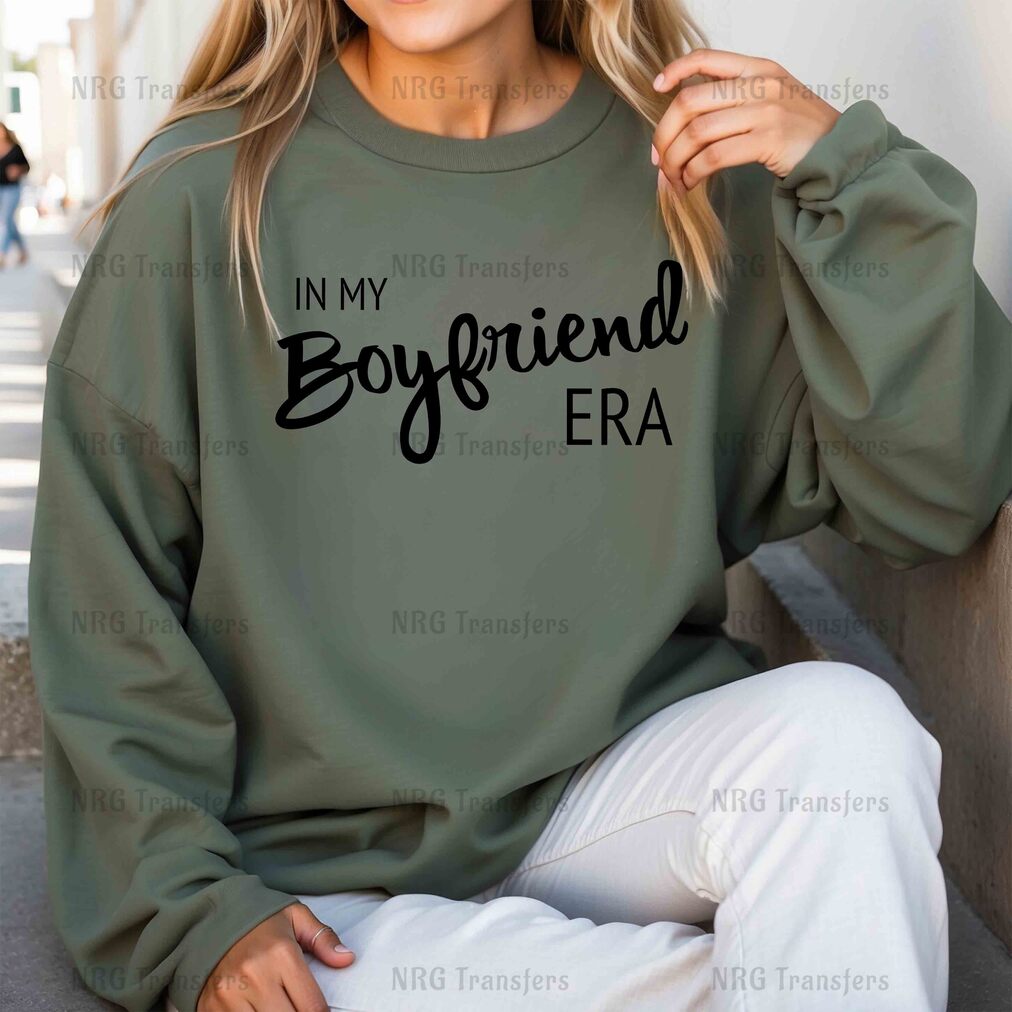 a woman wearing a sweatshirt that says in my boyfriend era