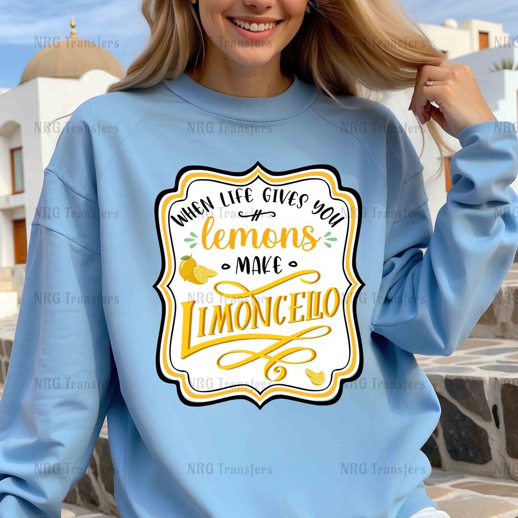 a woman wearing a blue sweatshirt with lemons on it