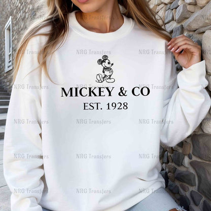 a woman wearing a mickey and co sweatshirt