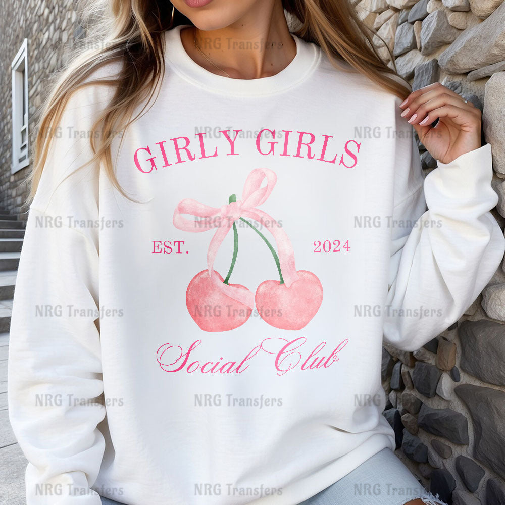 a woman wearing a white sweatshirt with cherries on it