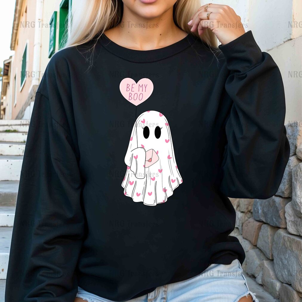 a woman wearing a black sweatshirt with a ghost on it