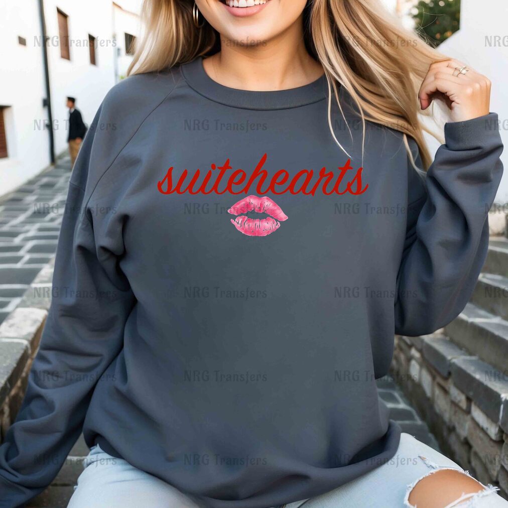 a woman wearing a sweatshirt with the words suitetheans on it