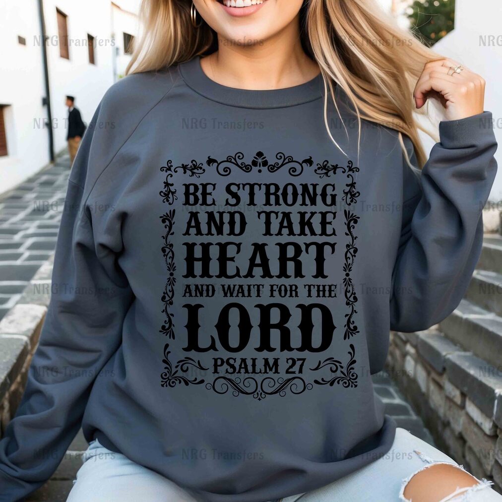 a woman wearing a sweatshirt that says be strong and take heart and wait for the