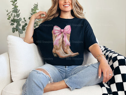 a woman sitting on a couch wearing a t - shirt with a picture of a