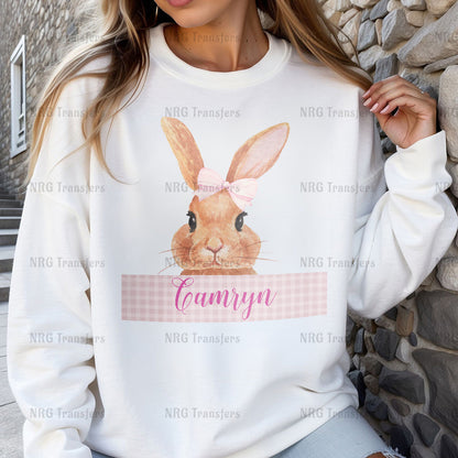 a woman wearing a sweatshirt with a bunny on it