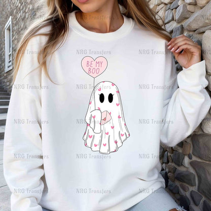 a woman wearing a white sweatshirt with a heart balloon on it