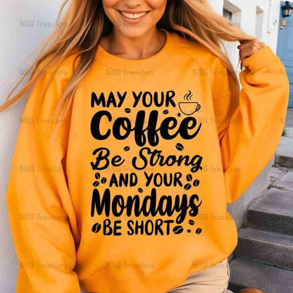 a woman wearing a sweatshirt that says may your coffee be strong and your mondays