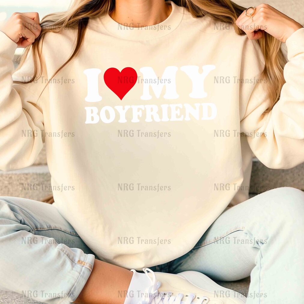 a woman wearing a sweatshirt that says i love my boyfriend