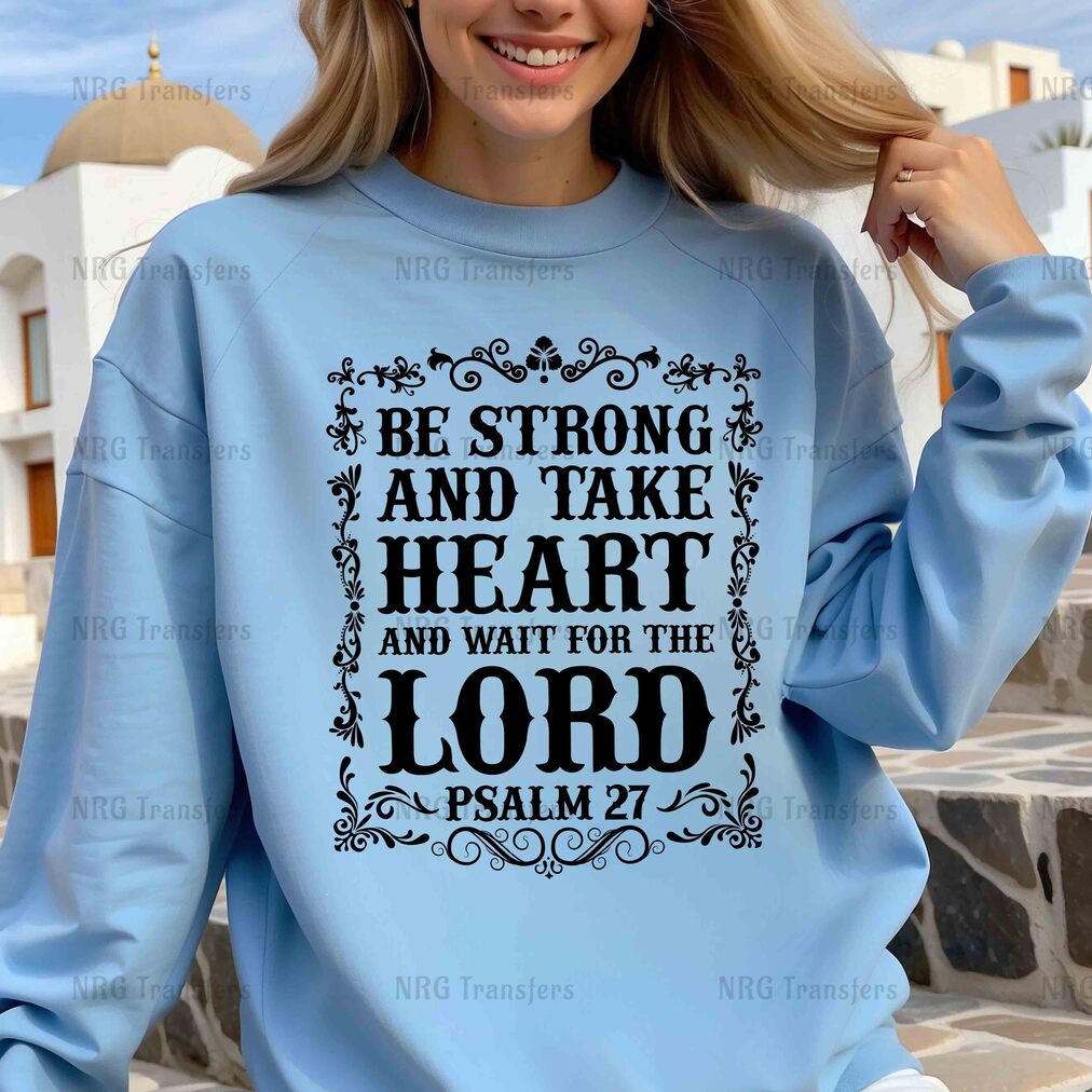 a woman wearing a blue sweatshirt that says be strong and take heart and wait for