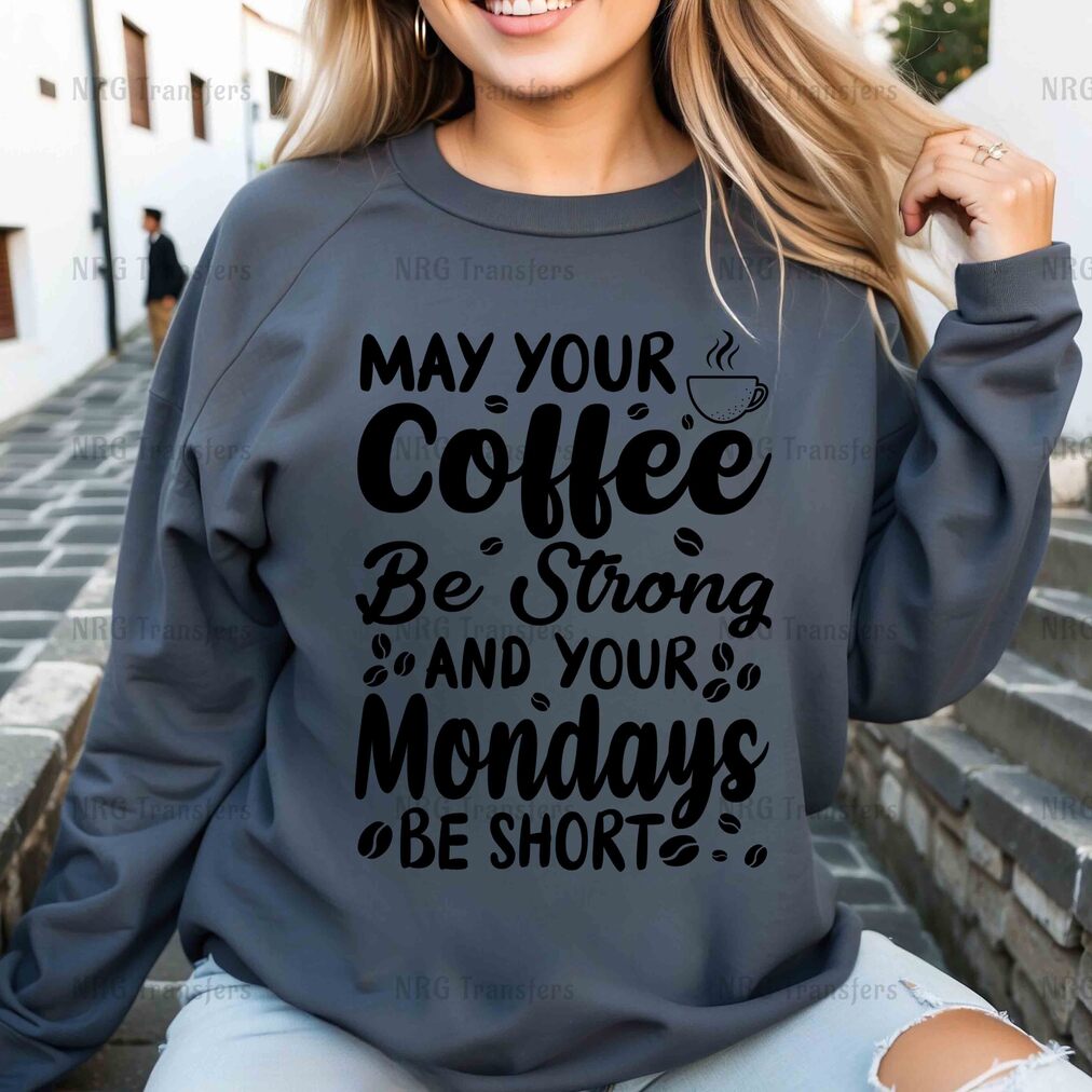 a woman wearing a sweatshirt that says may your coffee be strong and your mondays