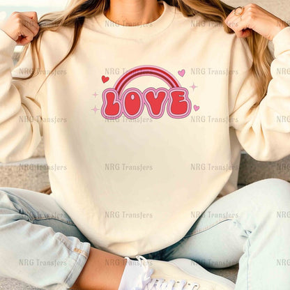 a woman sitting on a couch wearing a sweatshirt with the word love on it