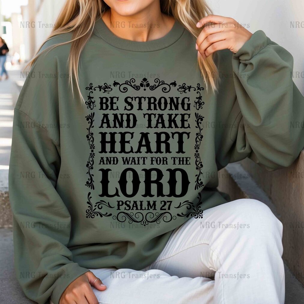 a woman wearing a sweatshirt that says be strong and take heart and wait for the