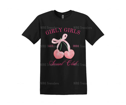 a black t - shirt with a pink bow and two cherries