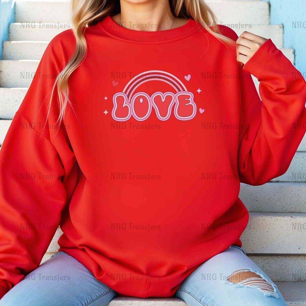 a woman wearing a red sweatshirt with the word love on it